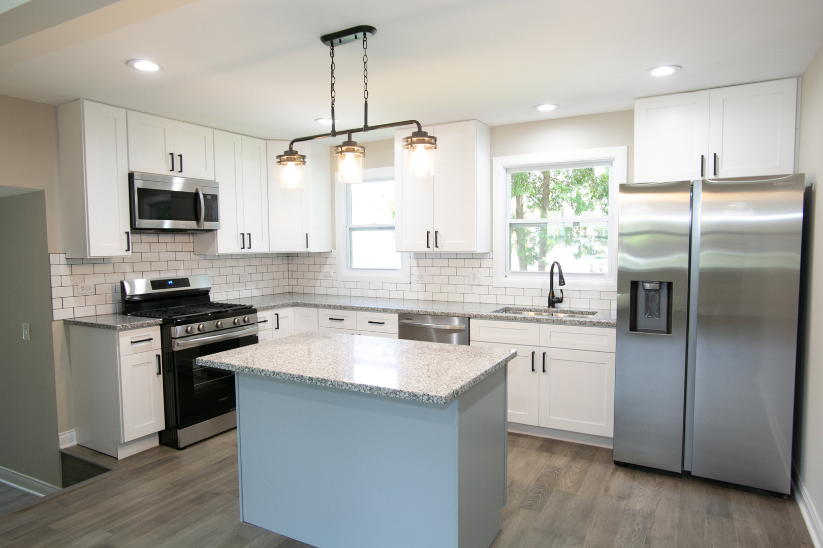 6000 Birmingham Street Chicago Ridge, IL 60415 - Photo 6 of 23 a kitchen with kitchen island granite countertop a sink stainless steel appliances and window