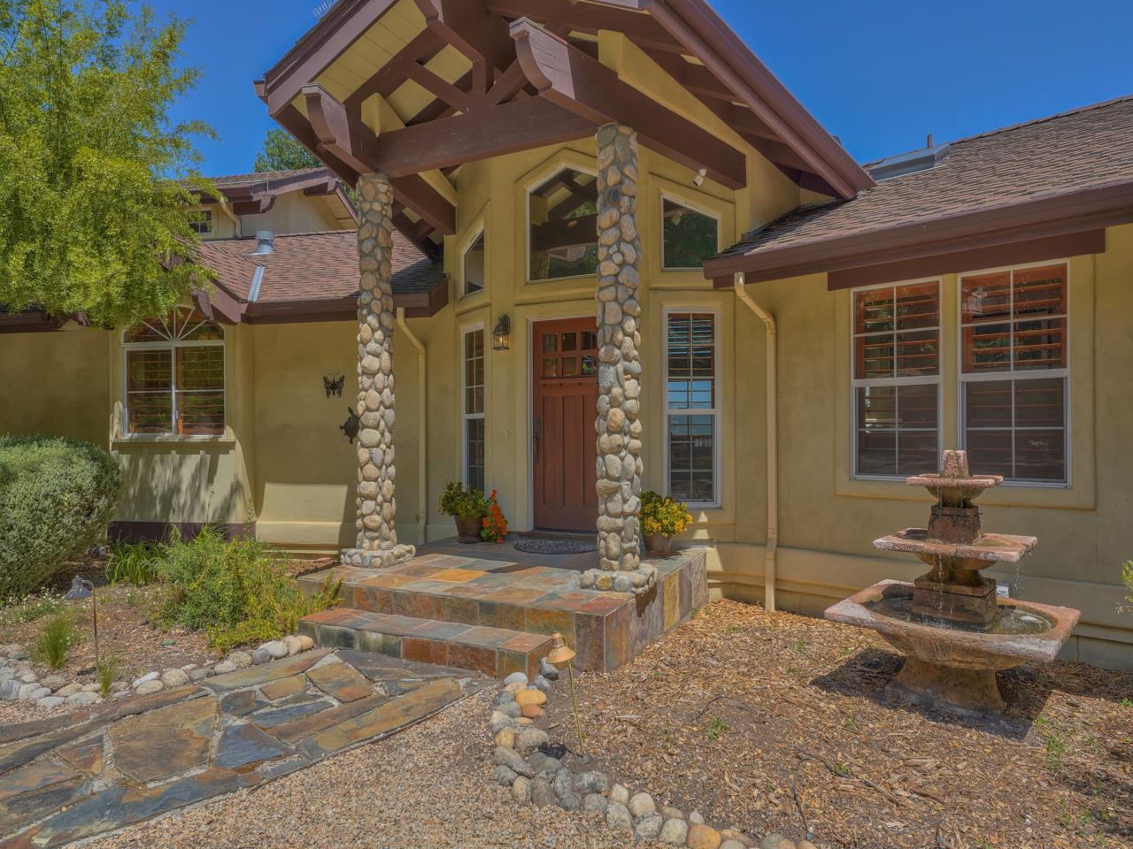 27470 Schulte Road Carmel, CA 93923 - Photo 2 of 56 a front view of a house with garden