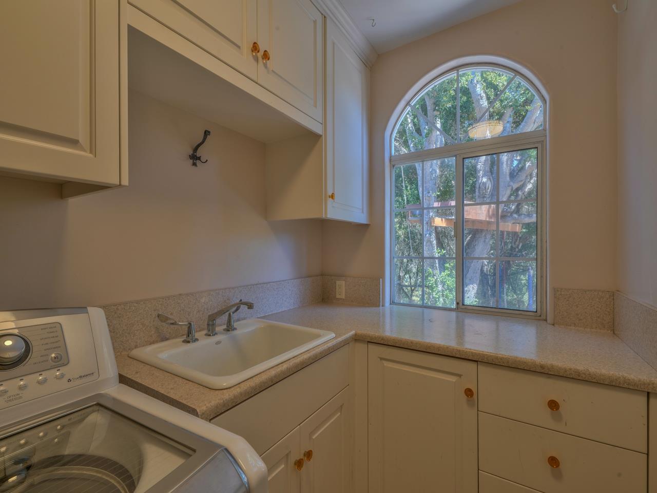 27470 Schulte Road Carmel, CA 93923 - Photo 16 of 56 a bathroom with a sink and a window