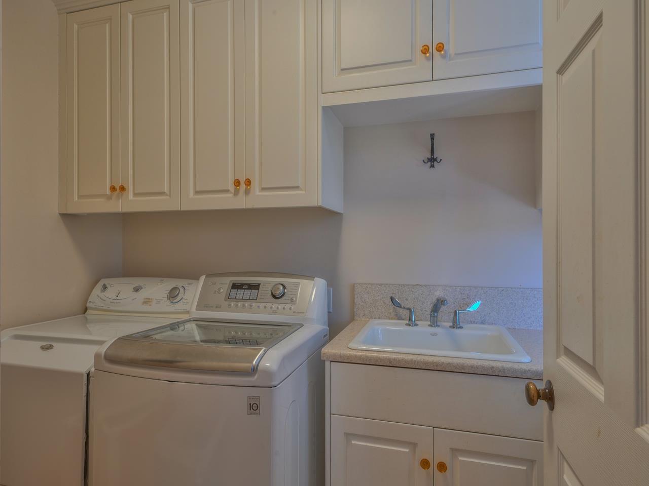 27470 Schulte Road Carmel, CA 93923 - Photo 17 of 56 a utility room with dryer and washer