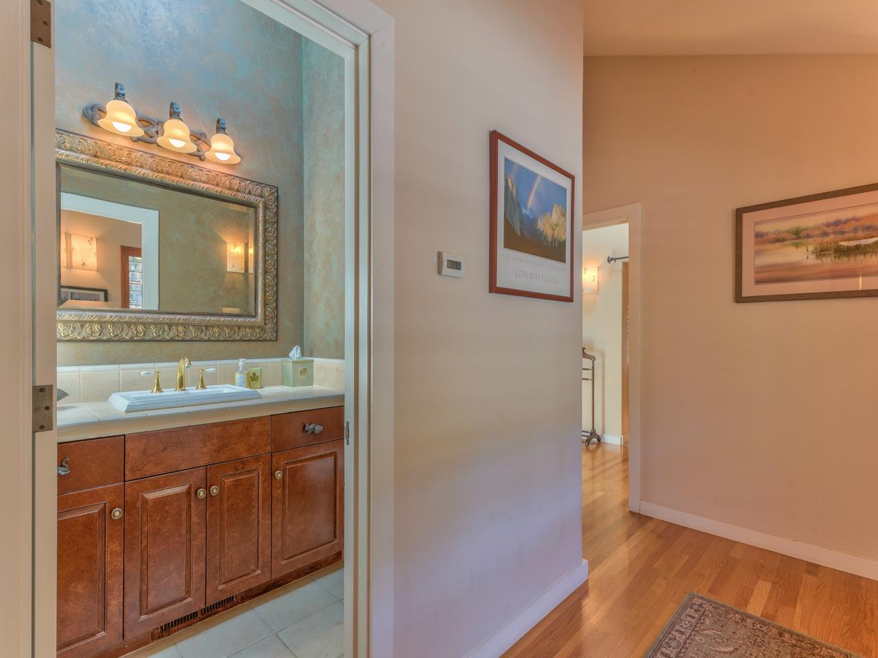 27470 Schulte Road Carmel, CA 93923 - Photo 18 of 56 a bathroom with a double vanity sink and a mirror
