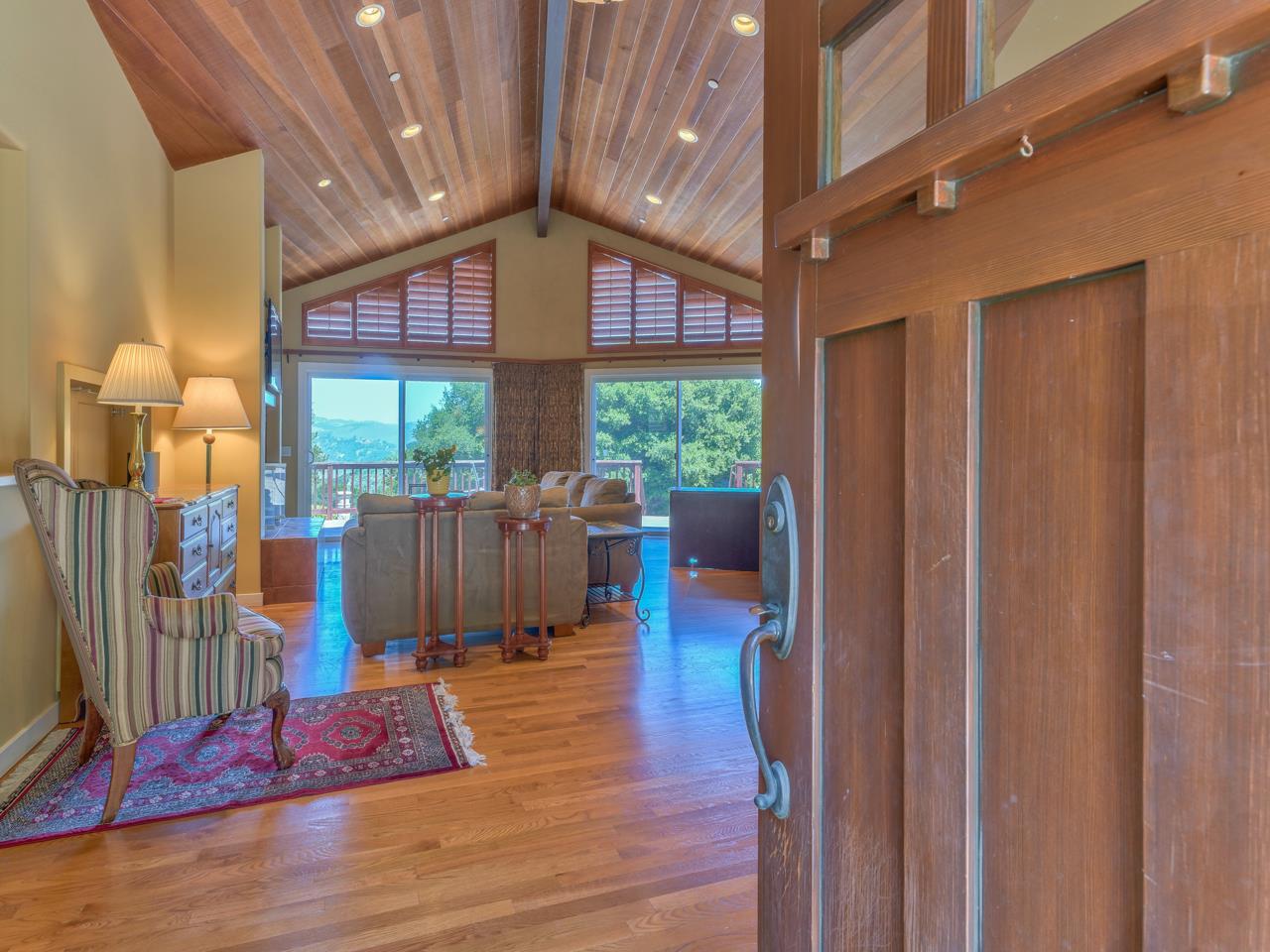 27470 Schulte Road Carmel, CA 93923 - Photo 3 of 56 a view of a balcony with wooden floor and furniture