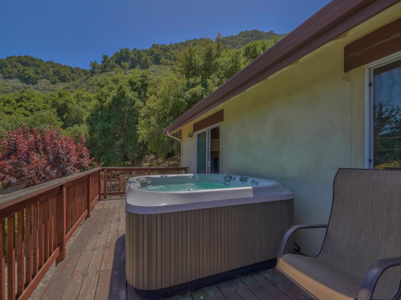 27470 Schulte Road Carmel, CA 93923 - Photo 22 of 56 a balcony with wooden floor and outdoor seating