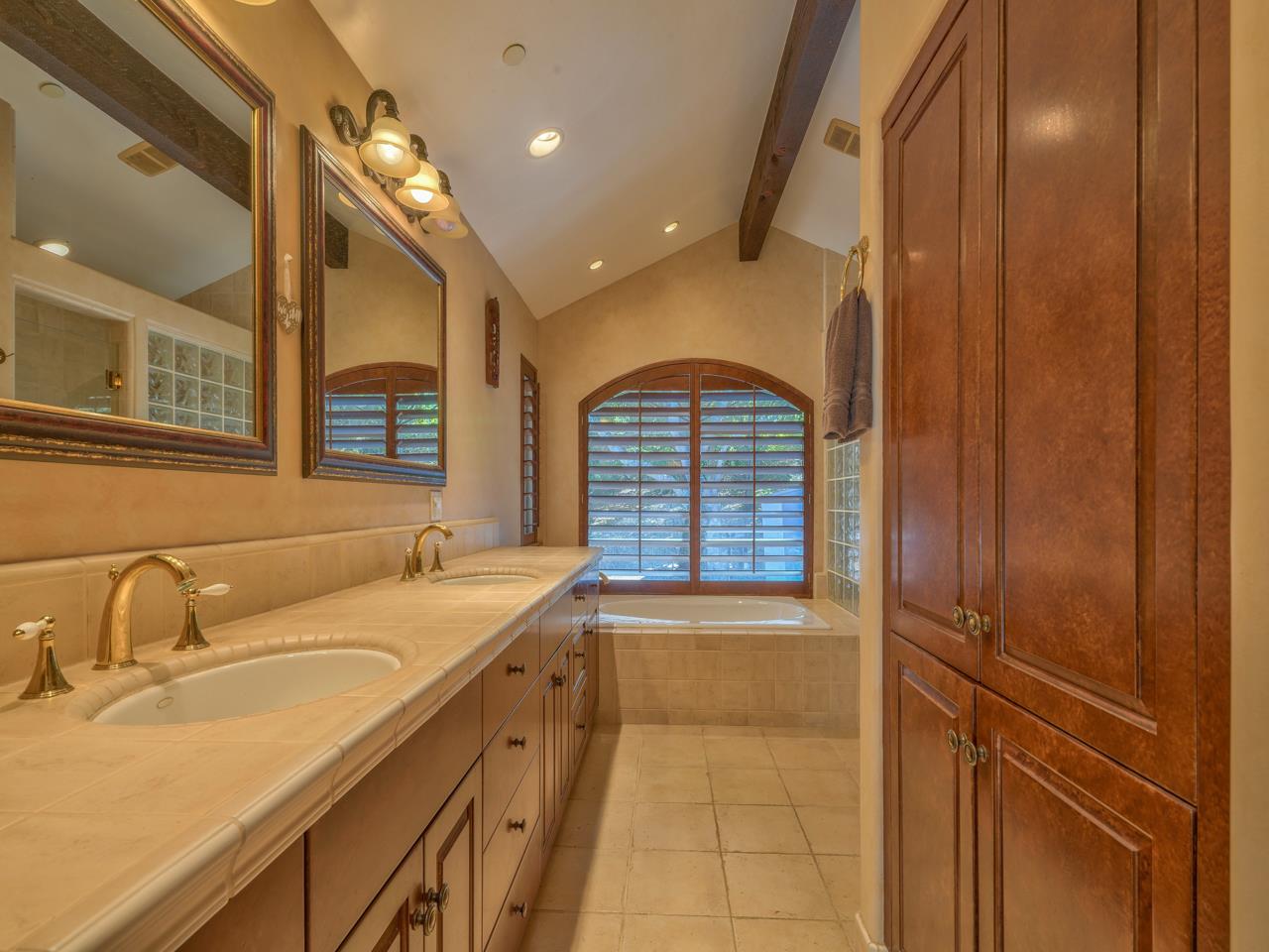 27470 Schulte Road Carmel, CA 93923 - Photo 23 of 56 a bathroom with a sink and a mirror