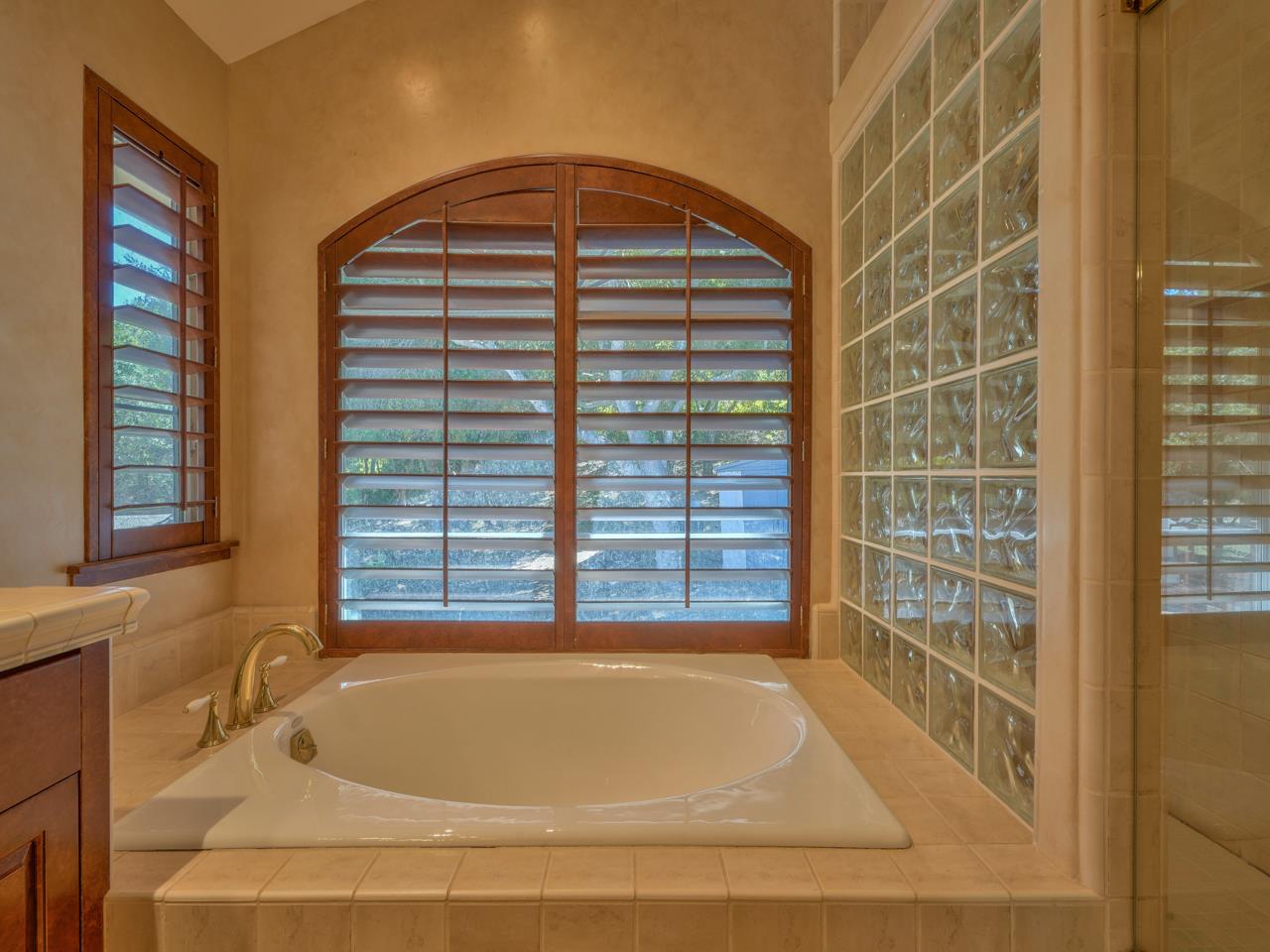 27470 Schulte Road Carmel, CA 93923 - Photo 24 of 56 a bathroom with a bathtub and window
