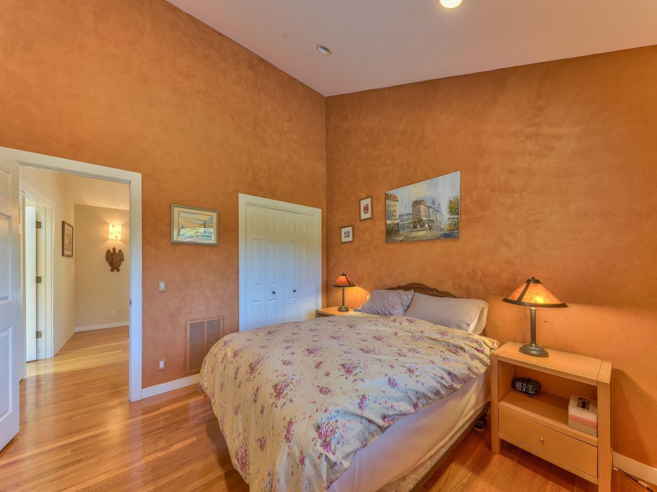 27470 Schulte Road Carmel, CA 93923 - Photo 27 of 56 a bedroom with a bed and wooden floor