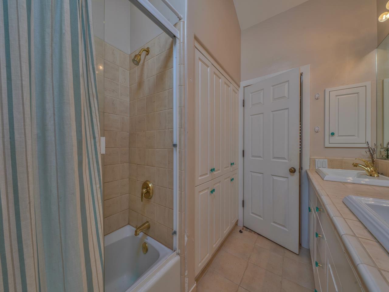 27470 Schulte Road Carmel, CA 93923 - Photo 36 of 56 a bathroom with a tub sink and mirror