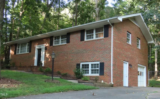 a view of house with yard