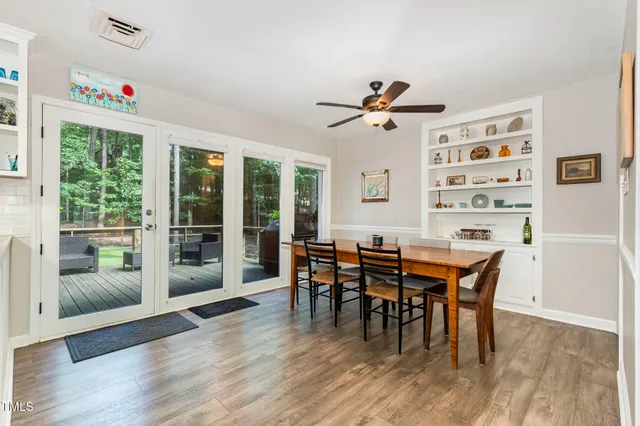a living room with furniture window and wooden floor