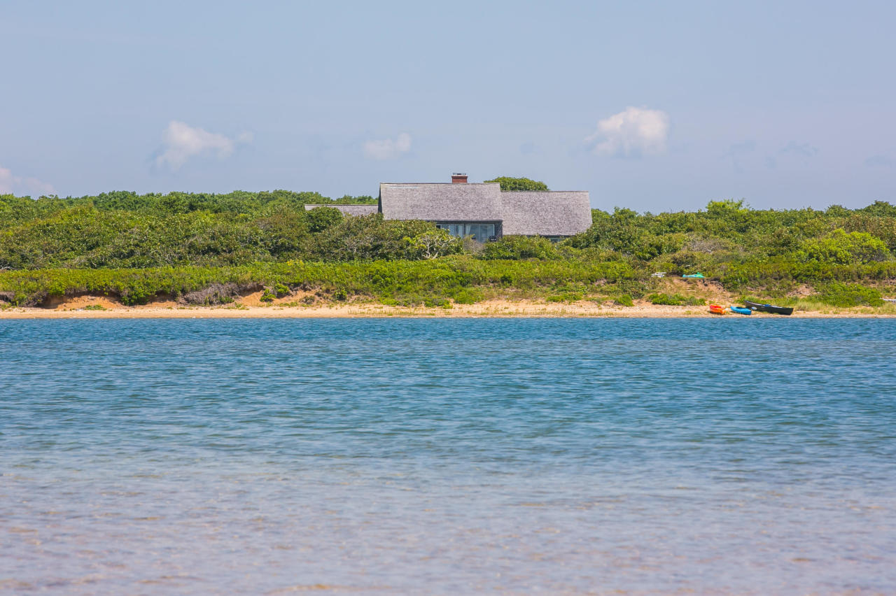 50 Oyster Watcha Road Edgartown, MA 02539 - Photo 19 of 27 a view of a lake with houses in the back