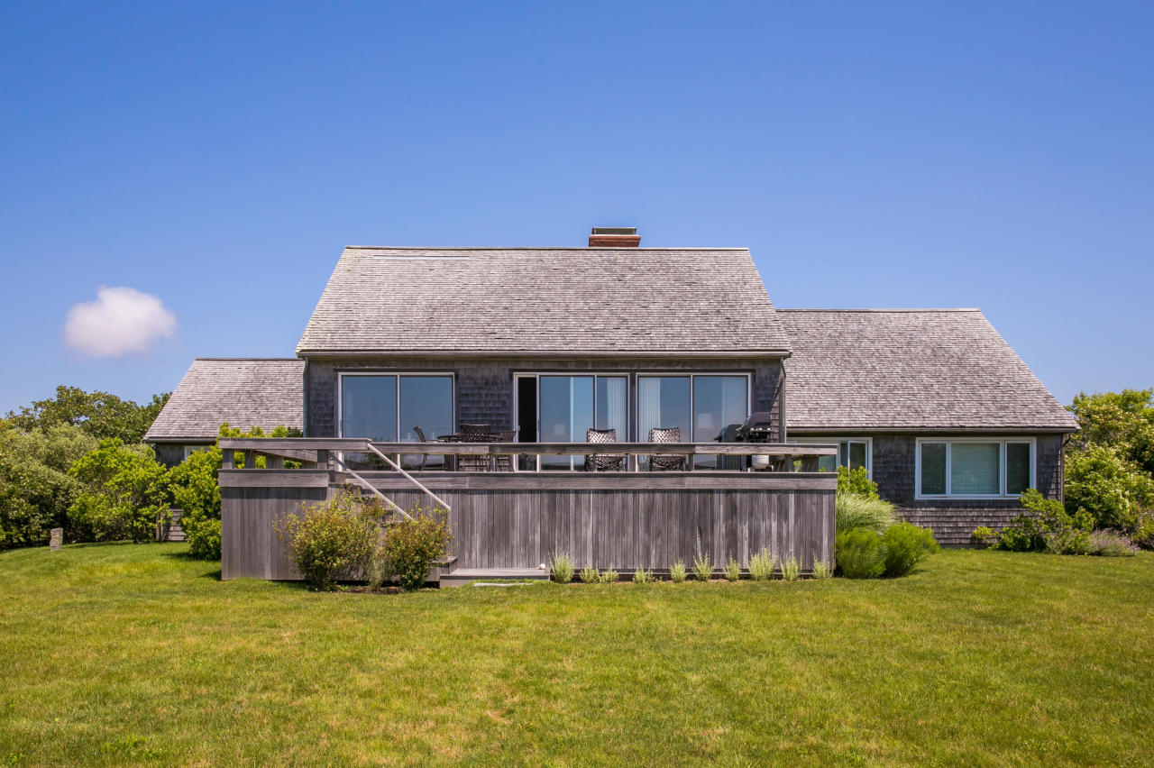 50 Oyster Watcha Road Edgartown, MA 02539 - Photo 20 of 27 a view of a house with a yard and sitting area