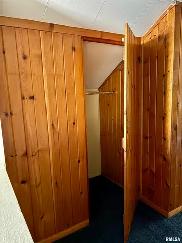a view of an empty room with wooden door