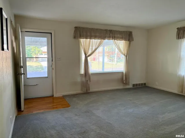 a room with a dresser and a mirror