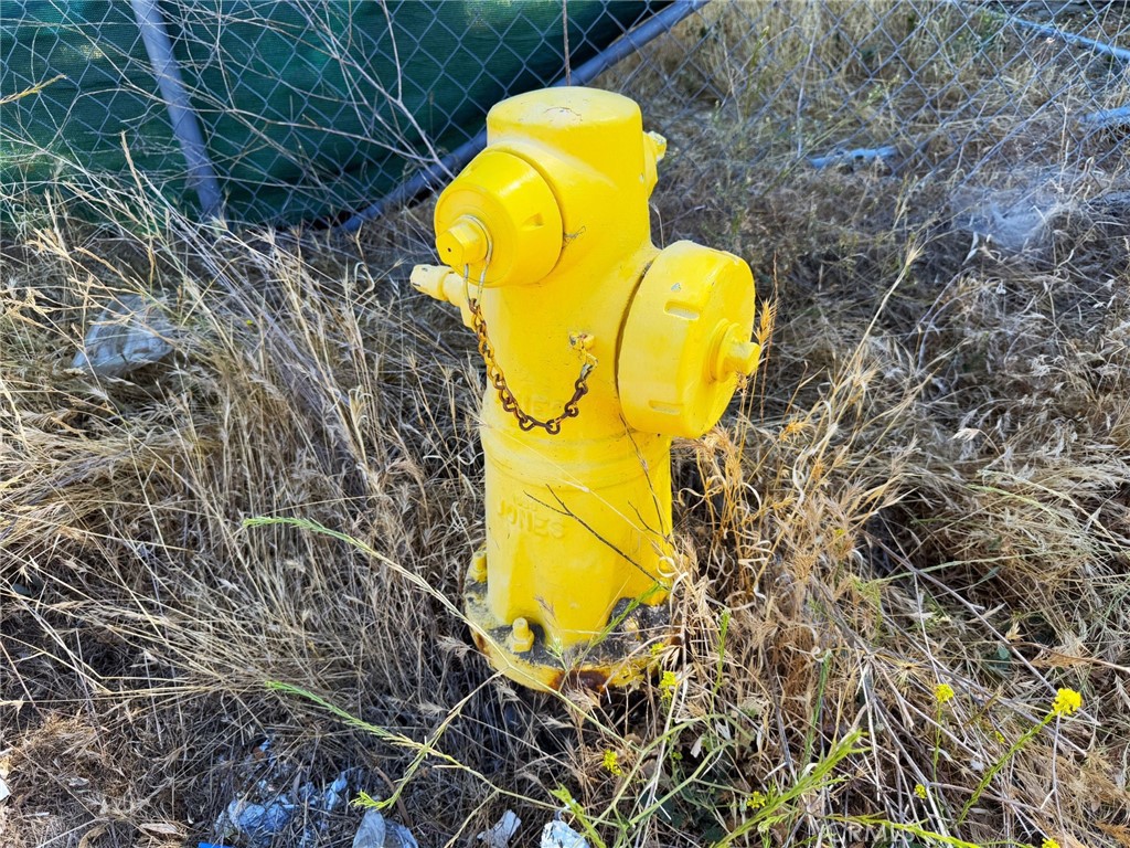 0 Garner Road Lake Elsinore, CA 92530 - Photo 12 of 13 a view of a swimming pool in he middle of the green field
