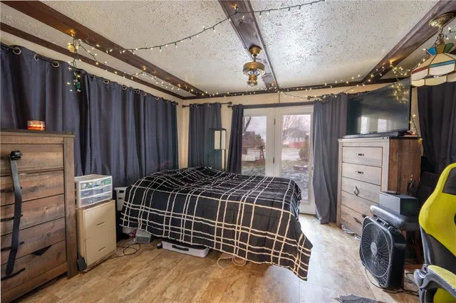 a bed room with a bed and a window