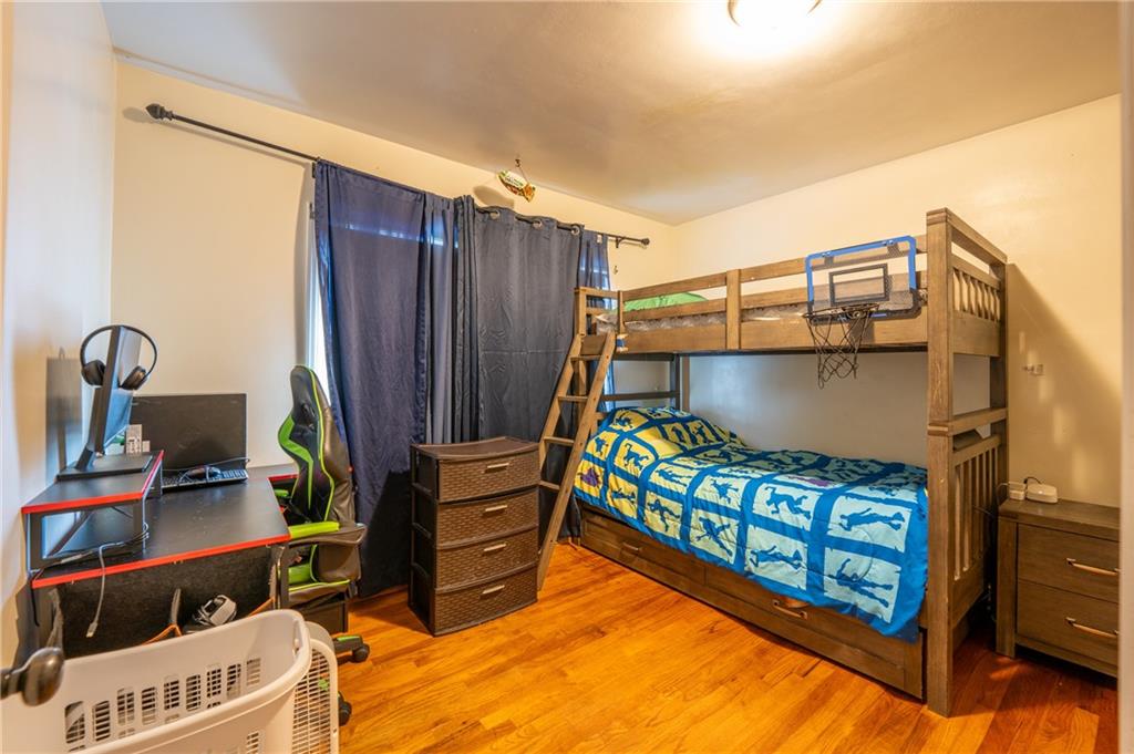 414 Smith Street Latrobe, PA 15650 - Photo 16 of 23 a bedroom with bunk bed and a window