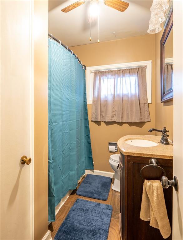 414 Smith Street Latrobe, PA 15650 - Photo 17 of 23 a bathroom with a sink and mirror with bathtub