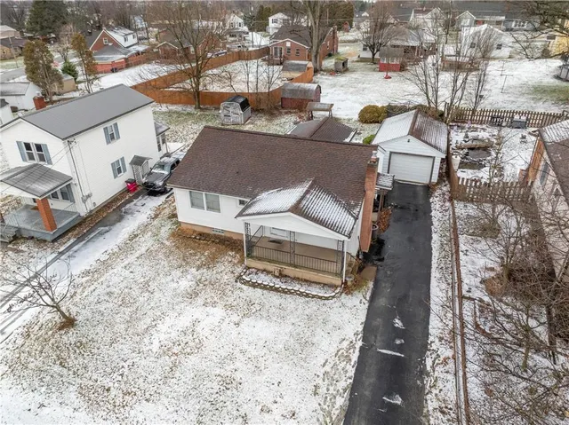 a aerial view of a house with a yard