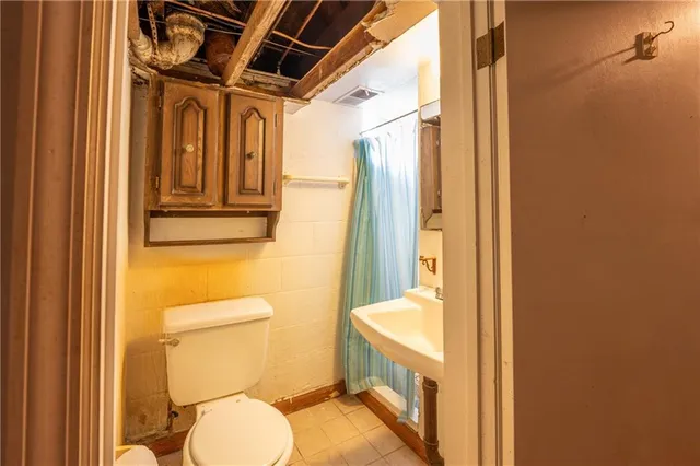 a bathroom with a granite countertop window and a sink