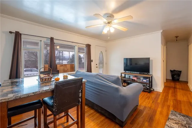 a view of a livingroom with furniture and a flat screen tv