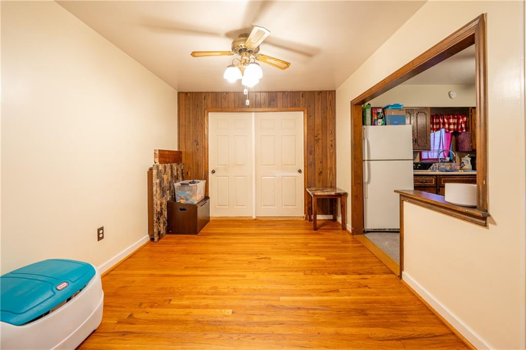 414 Smith Street Latrobe, PA 15650 - Photo 7 of 23 a bedroom with a bed and a chandelier