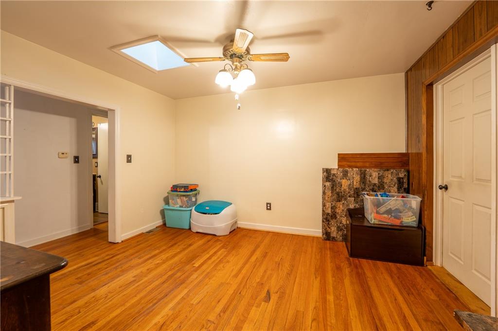 414 Smith Street Latrobe, PA 15650 - Photo 8 of 23 a bedroom with a bed and a wooden floor