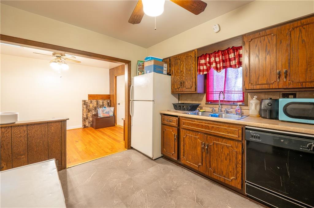 414 Smith Street Latrobe, PA 15650 - Photo 9 of 23 a kitchen with refrigerator and cabinets
