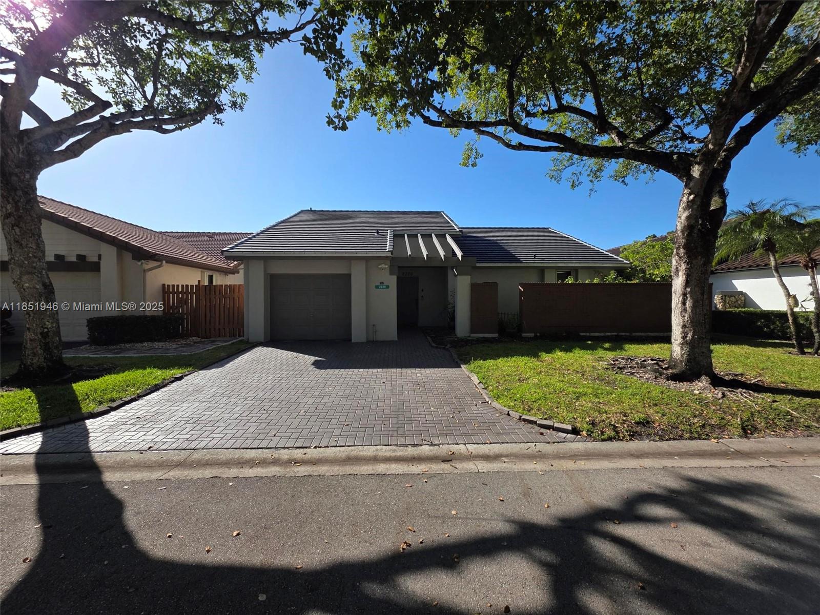 2320 Dover, Unit 2320 Weston, FL 33326 - Photo 1 of 44 a house view with a garden space