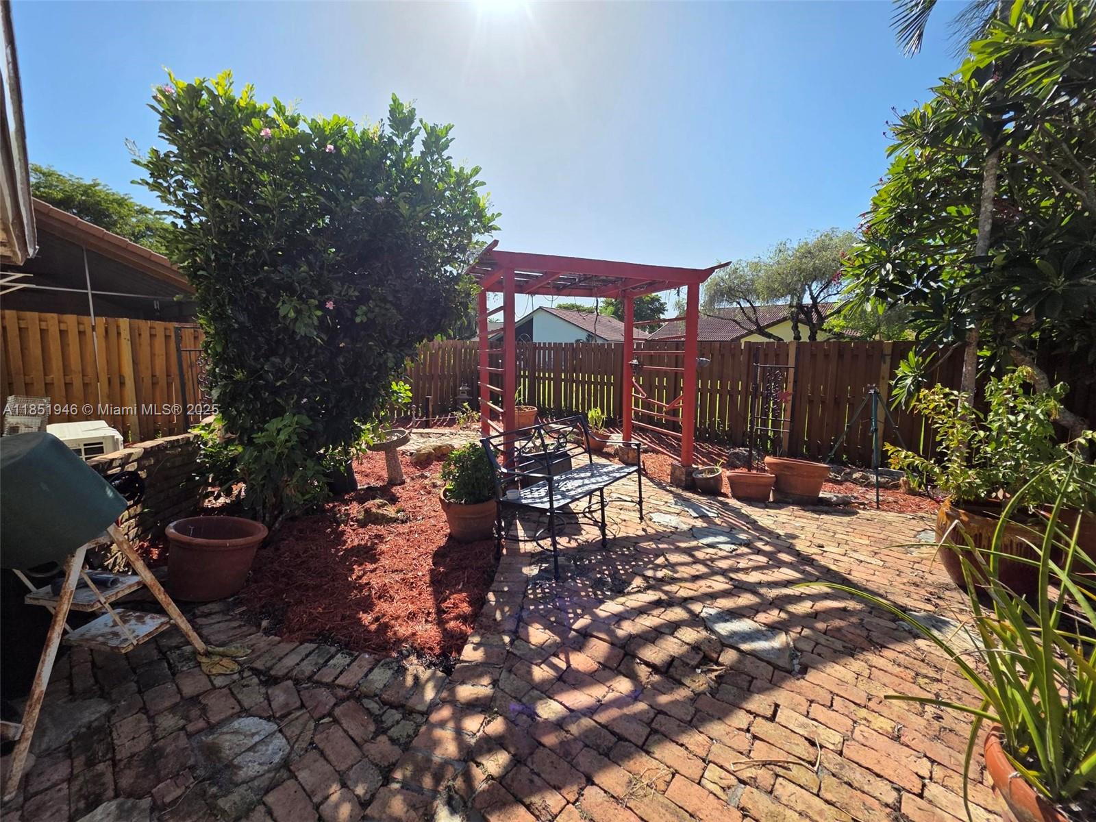 2320 Dover, Unit 2320 Weston, FL 33326 - Photo 20 of 44 a view of a chairs and tables in the patio