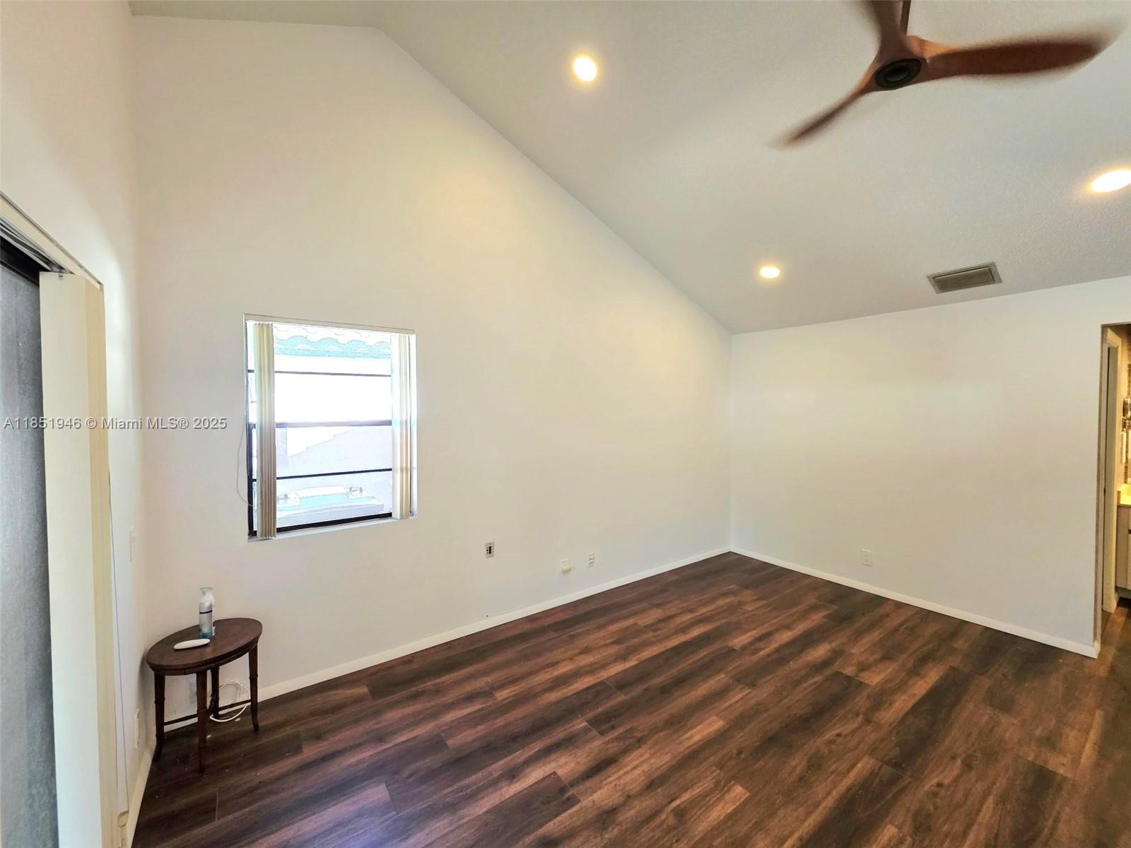 2320 Dover, Unit 2320 Weston, FL 33326 - Photo 26 of 44 an empty room with wooden floor and windows