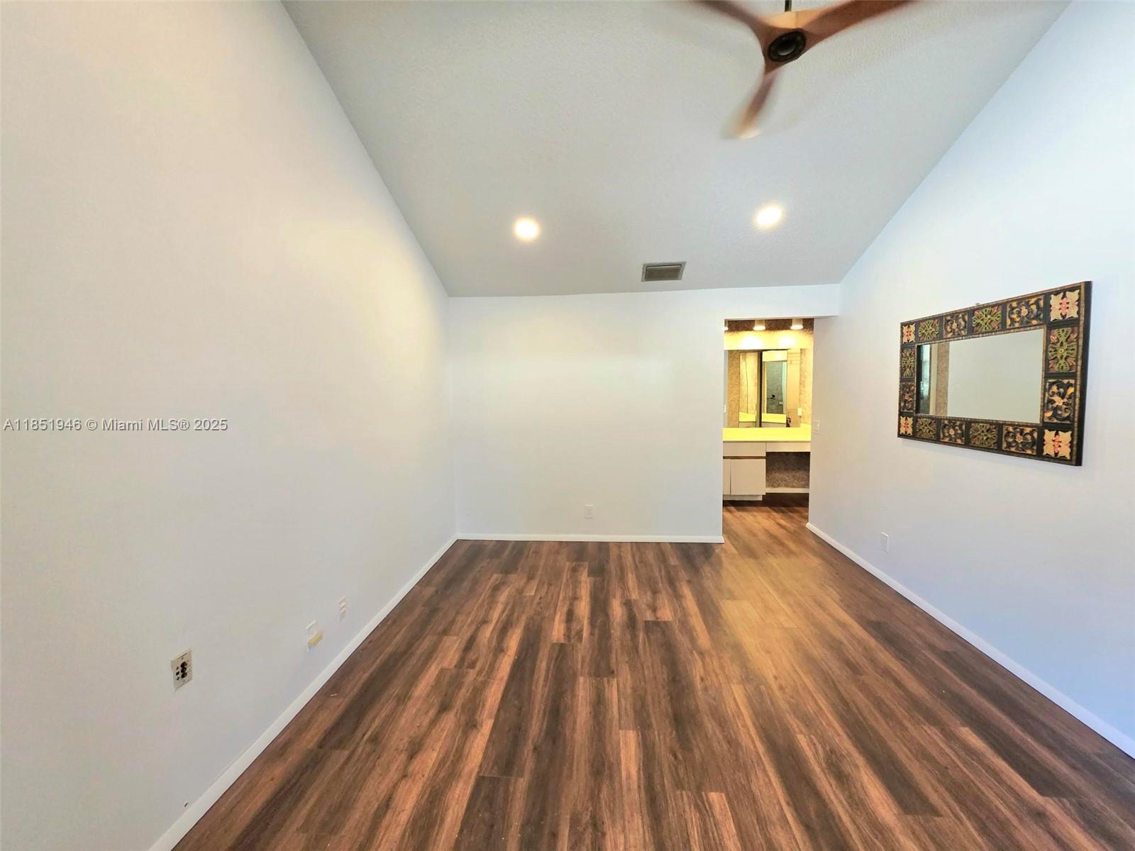 2320 Dover, Unit 2320 Weston, FL 33326 - Photo 27 of 44 a view of a room with wooden floor and window