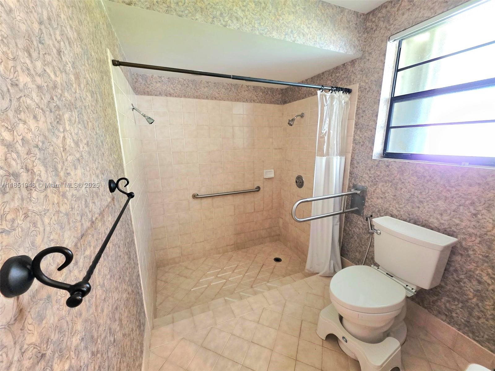 2320 Dover, Unit 2320 Weston, FL 33326 - Photo 29 of 44 a bathroom with a toilet and a shower