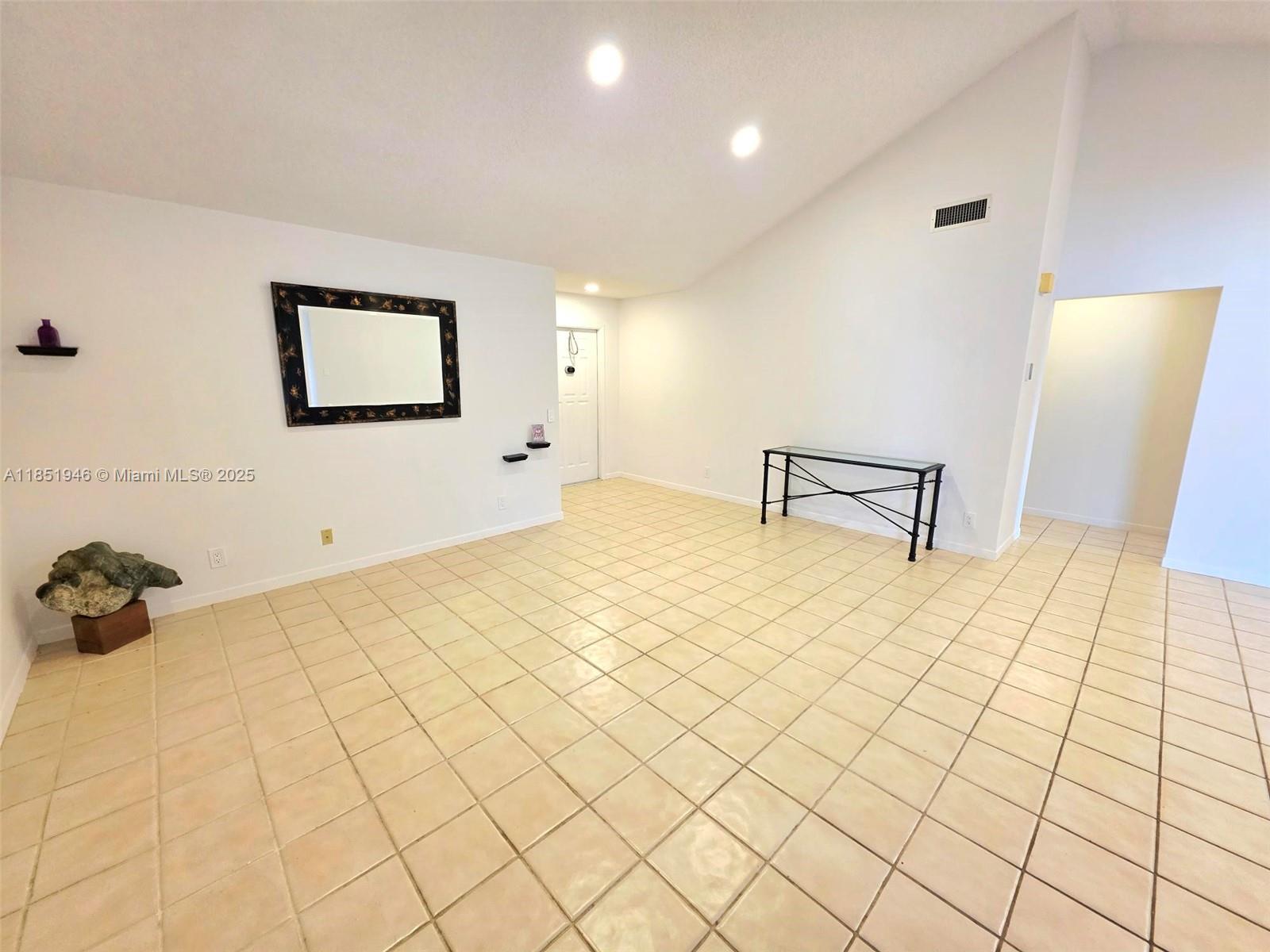2320 Dover, Unit 2320 Weston, FL 33326 - Photo 3 of 44 a bedroom with a bed and a lamp on table