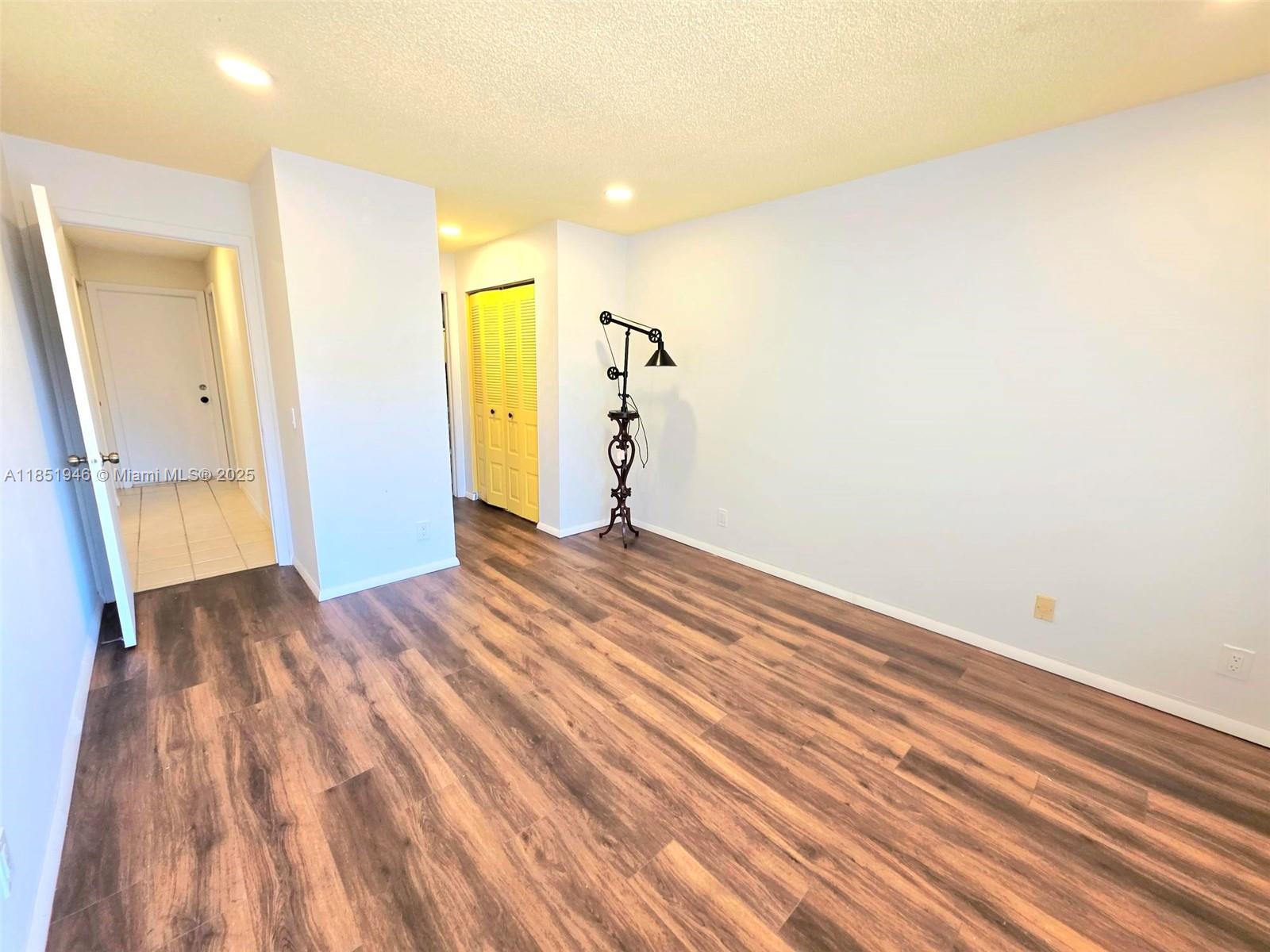 2320 Dover, Unit 2320 Weston, FL 33326 - Photo 35 of 44 a view of a room with wooden floor and stairs