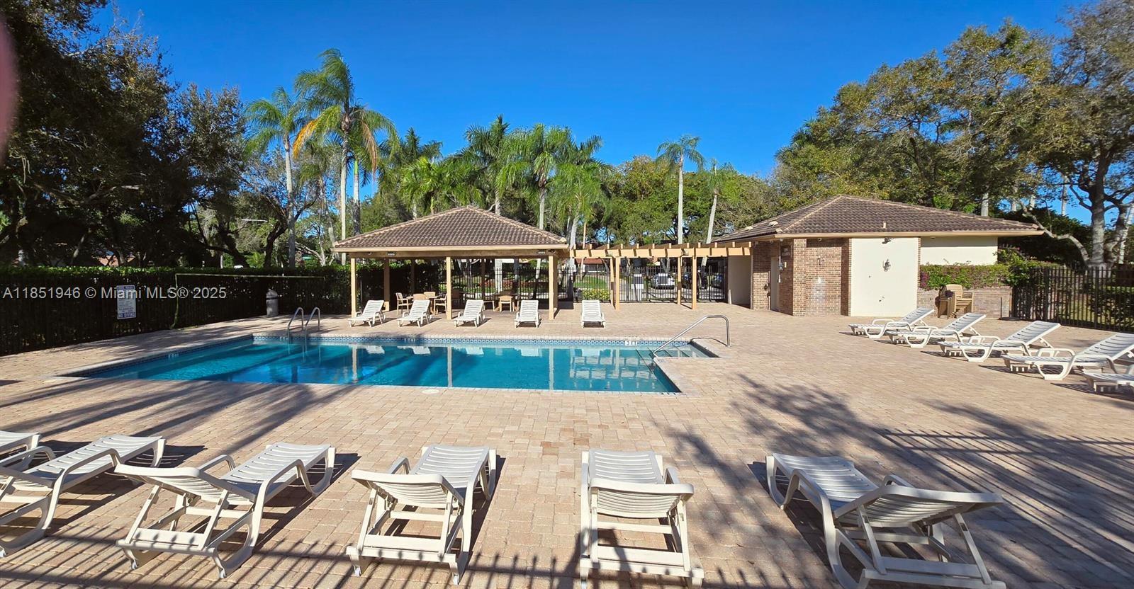 2320 Dover, Unit 2320 Weston, FL 33326 - Photo 42 of 44 a view of a swimming pool with a patio
