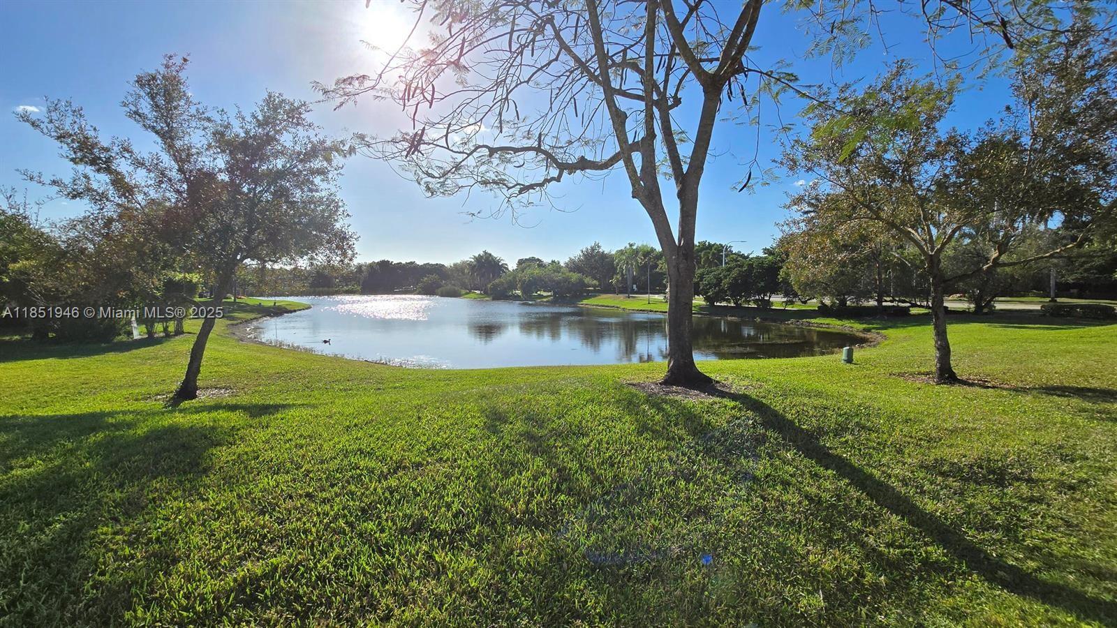 2320 Dover, Unit 2320 Weston, FL 33326 - Photo 43 of 44 a view of a park with large trees