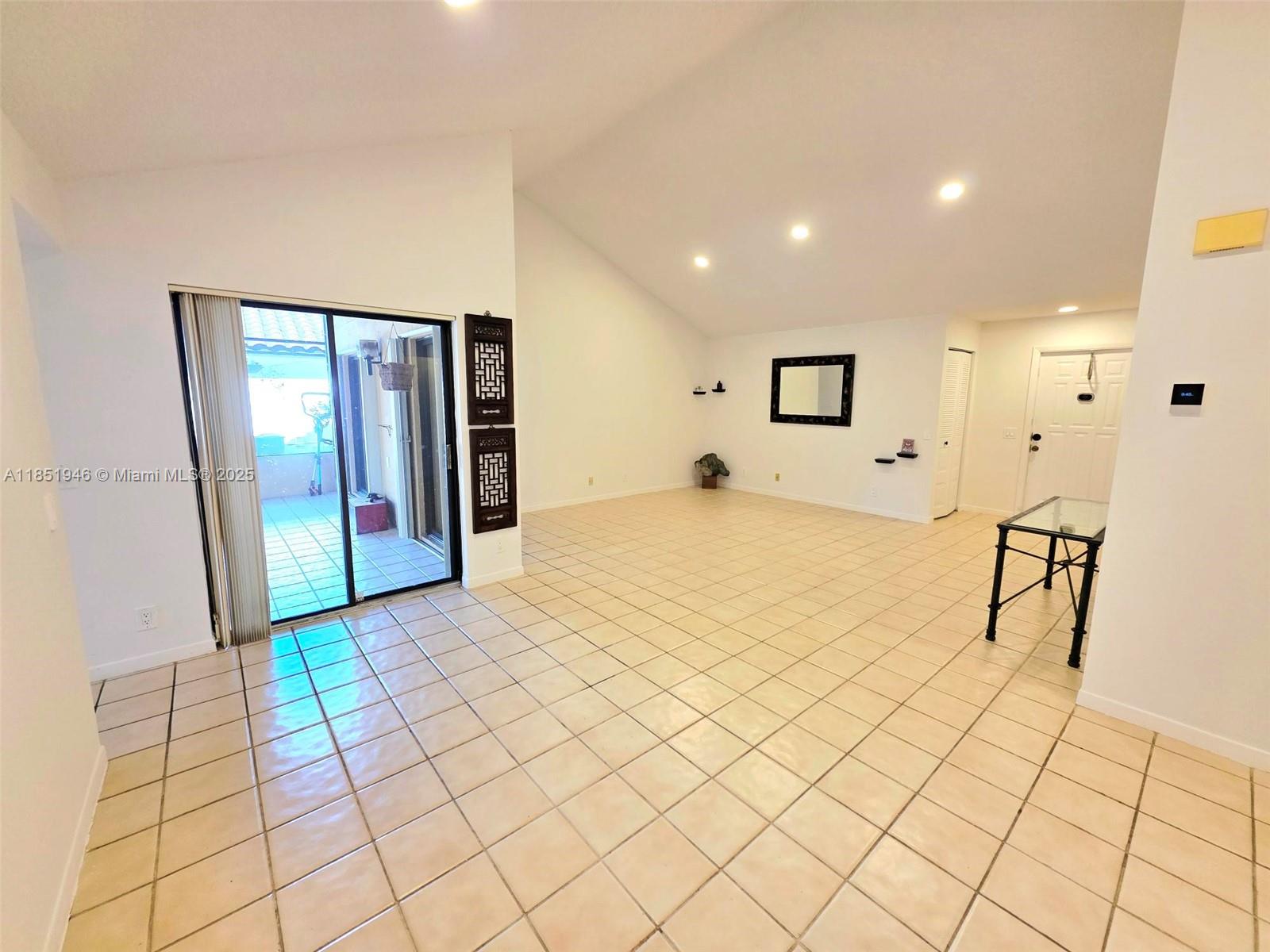 2320 Dover, Unit 2320 Weston, FL 33326 - Photo 10 of 44 a spacious bedroom with a bed and a mirror