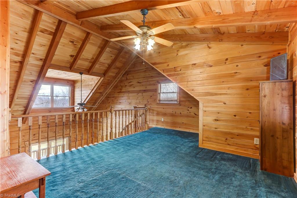 8605 Tuttle Ridge Road Germanton, NC 27019 - Photo 8 of 30 The lofted sitting area overlooks the master bedroom. The perfect space for a library, office, or workout area.