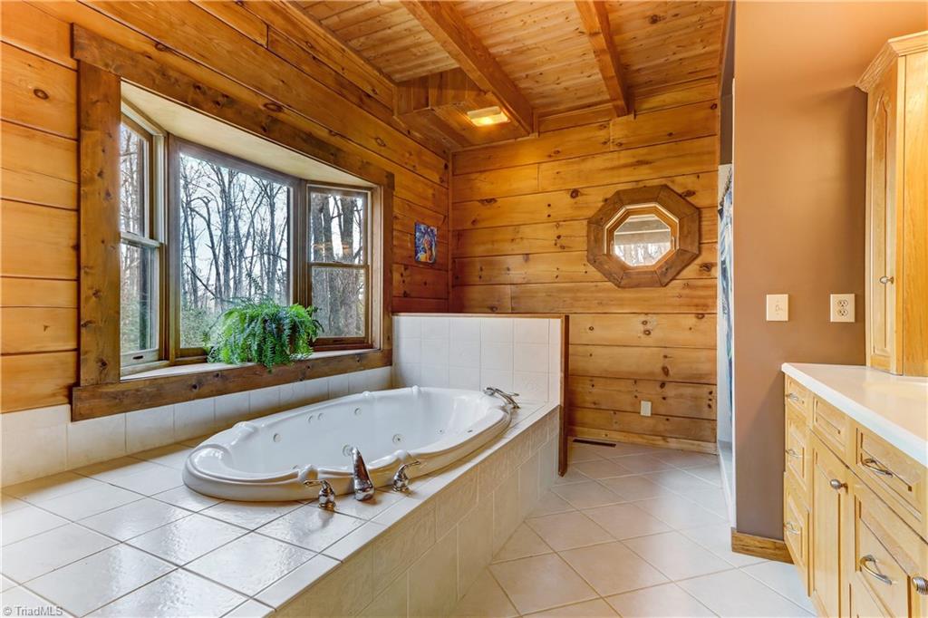 8605 Tuttle Ridge Road Germanton, NC 27019 - Photo 10 of 30 The jetted tub with private bay window overlooks the scenery outside.