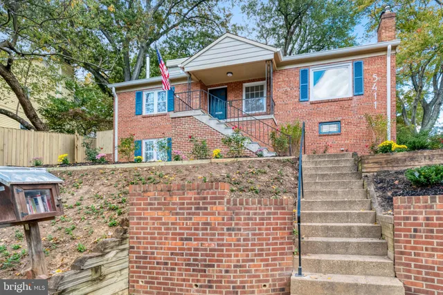 a front view of a house with parking