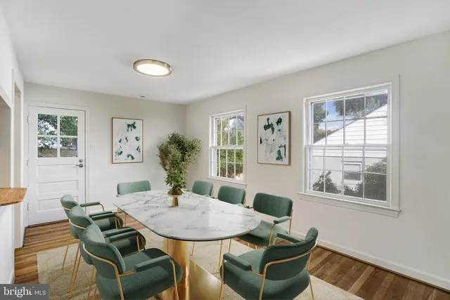 a view of a dining room with furniture and window