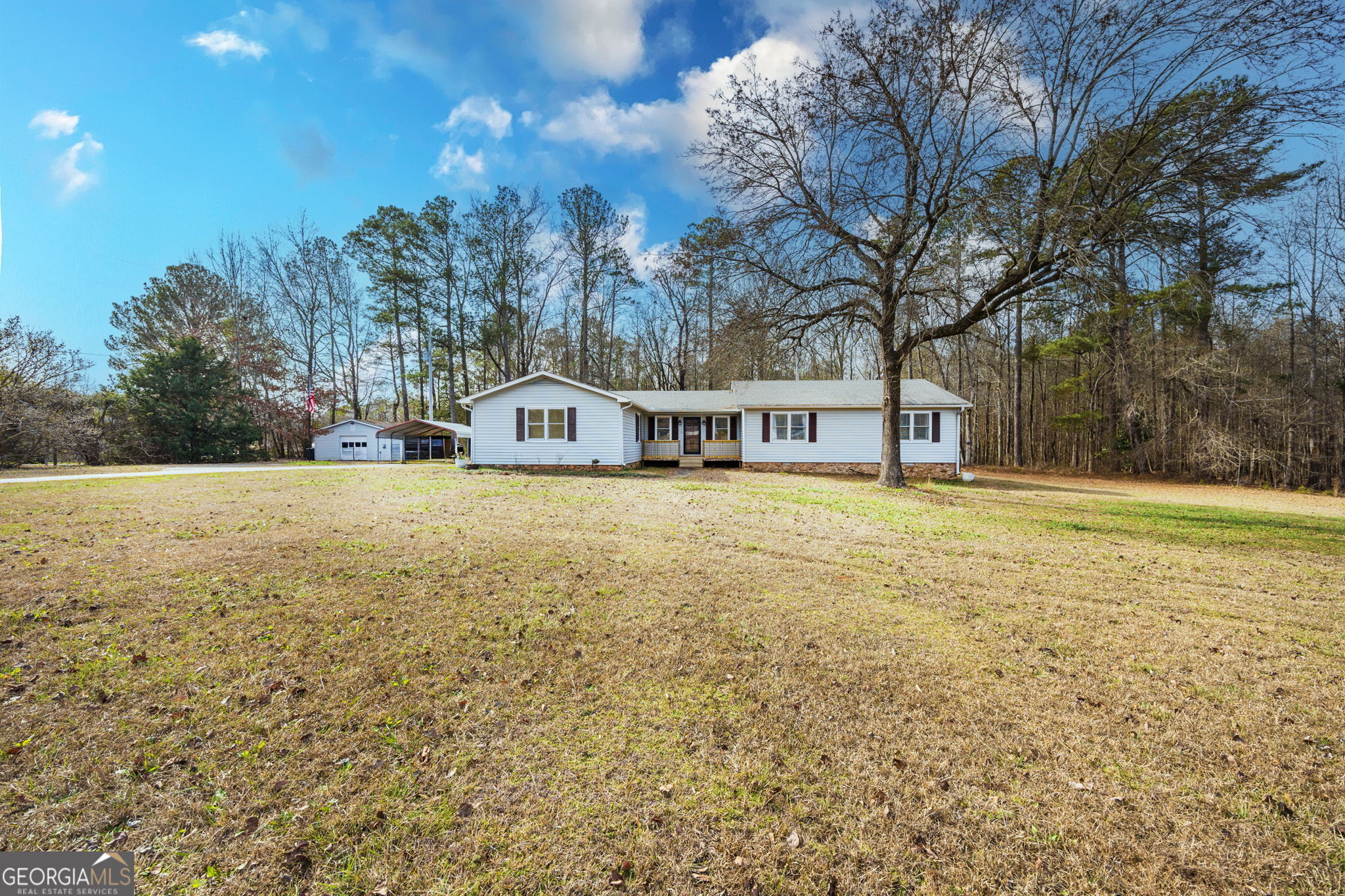 119 Old Town Road Gray, GA 31032 - Photo 1 of 39 a view of house with outdoor space and trees in the background
