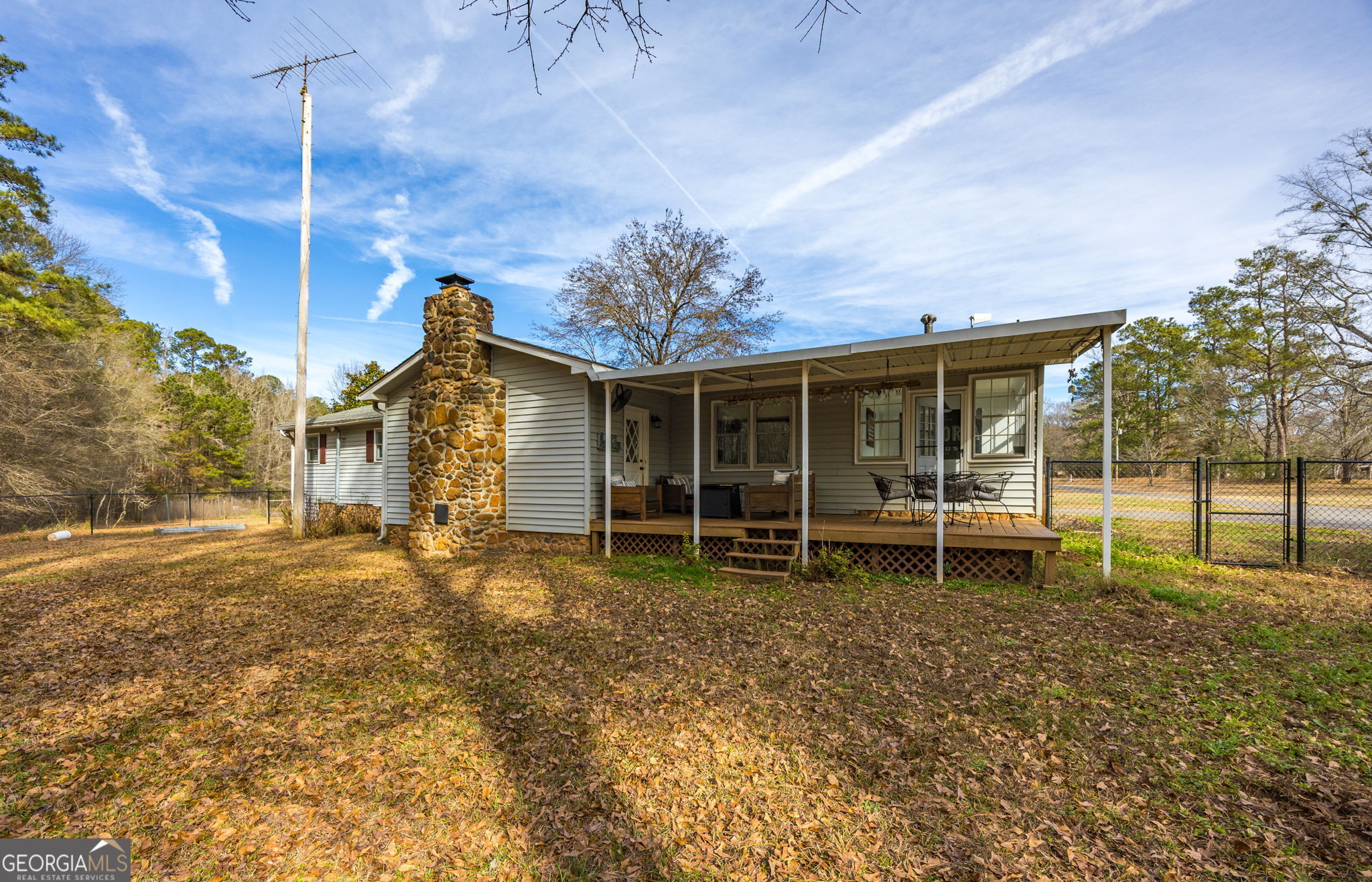 119 Old Town Road Gray, GA 31032 - Photo 31 of 39 a backyard of a house with table and chairs