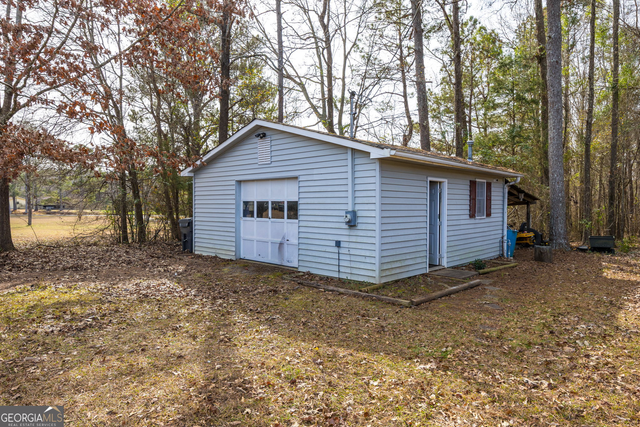 119 Old Town Road Gray, GA 31032 - Photo 39 of 39 a view of a house with a large tree and wooden fence