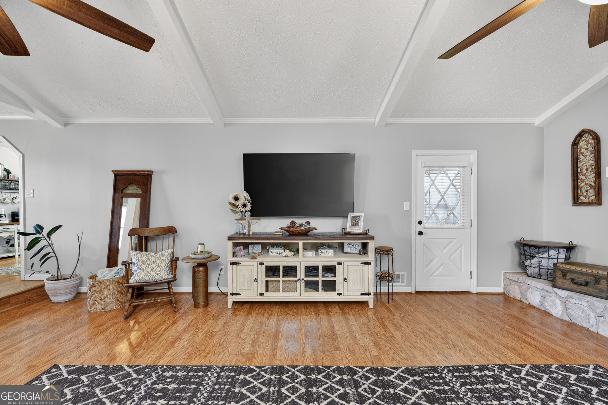 119 Old Town Road Gray, GA 31032 - Photo 6 of 39 a living room with furniture and a flat screen tv