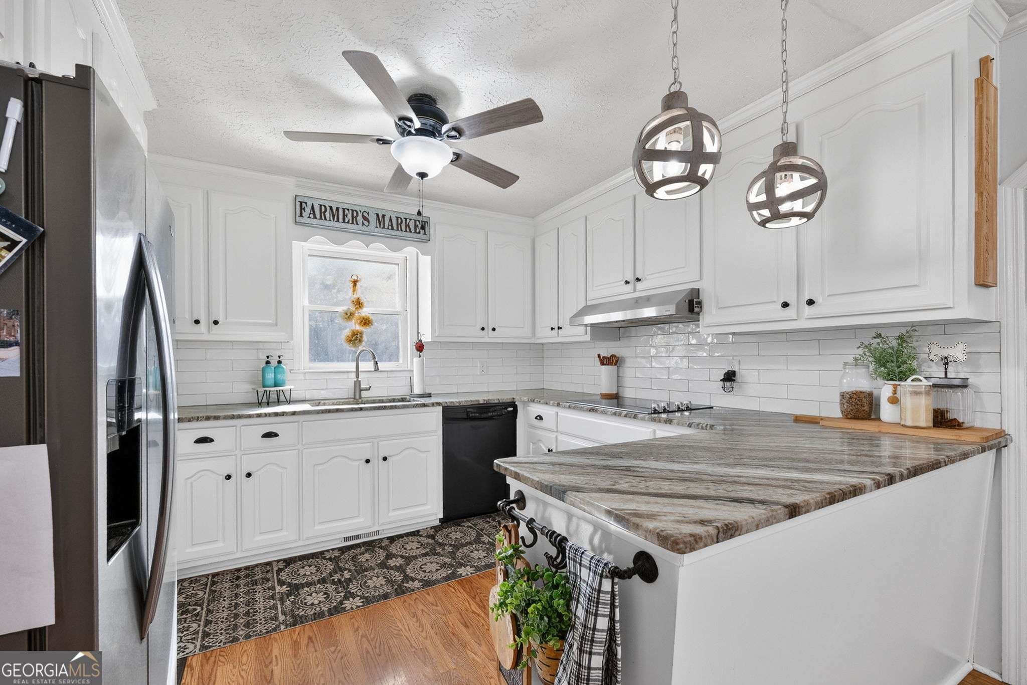 119 Old Town Road Gray, GA 31032 - Photo 7 of 39 a kitchen with granite countertop a sink appliances cabinets and a window