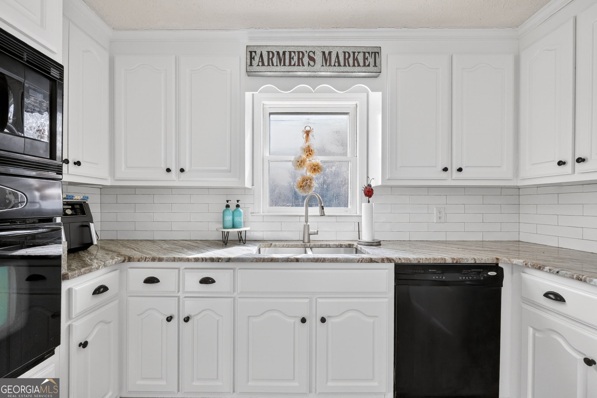 119 Old Town Road Gray, GA 31032 - Photo 8 of 39 a kitchen with stainless steel appliances granite countertop a sink and dishwasher with white cabinets