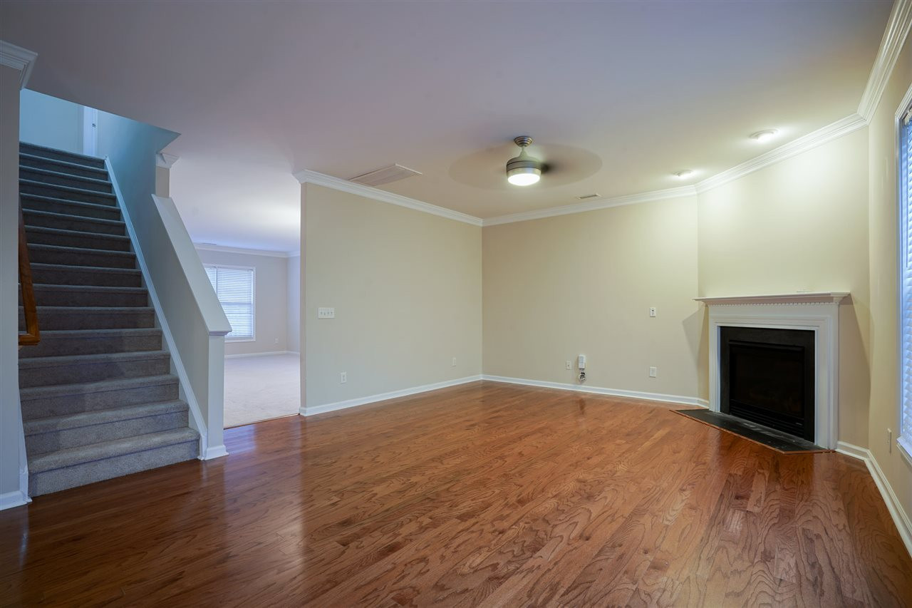 1517 Roaring Rapids Road Raleigh, NC 27610 - Photo 11 of 28 Open family room, with fireplace and new wood flooring. Family Room