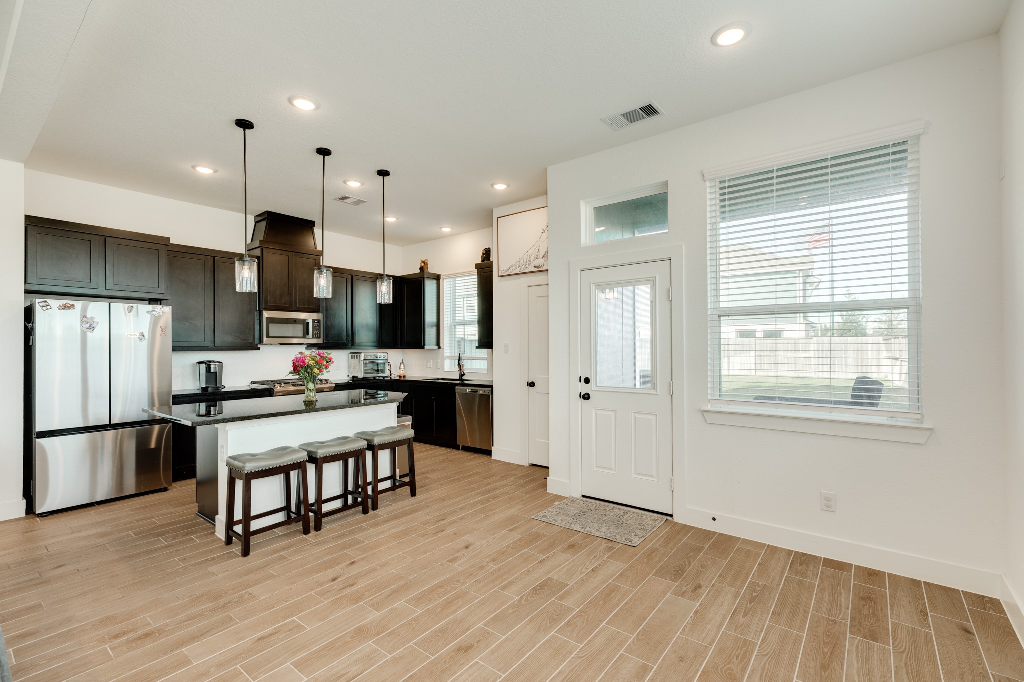 10002 Nectar Path Rosharon, TX 77583 - Photo 8 of 46 this view is of the dining area on the right , the back door and kitchen area on the left