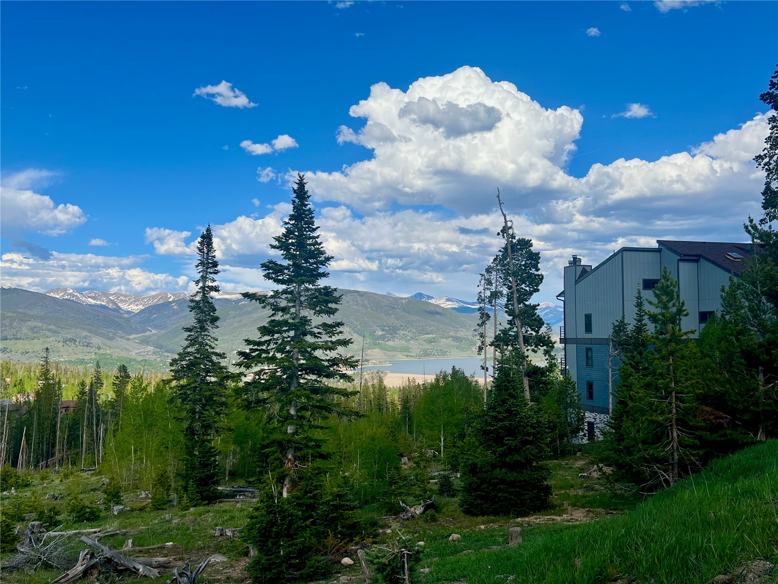 89410 Ryan Gulch Road, Unit 104 Silverthorne, CO 80498 - Photo 13 of 31 a view of a lake with a yard